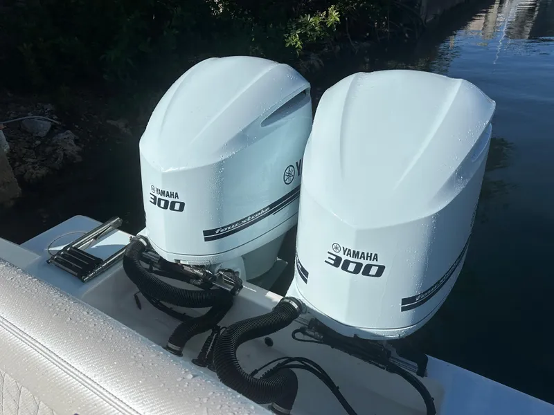 Slide: The Image of Twin Yamaha 300 outboard engines on a 2012 Contender 32 LS boat. - 12