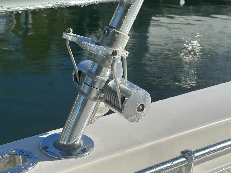 Slide: The Image of Close-up of a 2012 Contender 32 LS boat's stainless steel rod holder. - 19