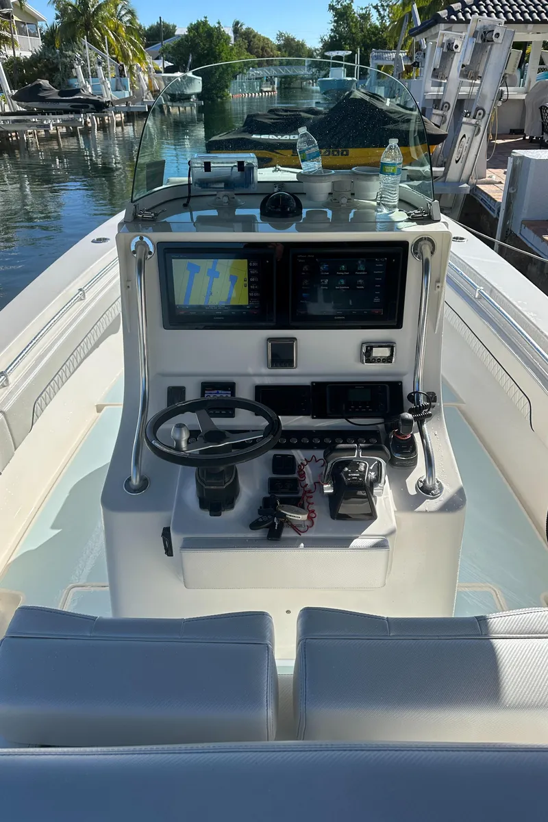 Slide: The Image of 2012 Contender 32 LS boat dashboard with navigation equipment and controls. - 25