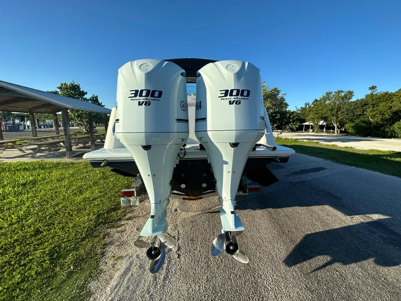 Slide: The Image of 2012 Contender 32 LS boat with twin 300 V6 outboard engines. - 5