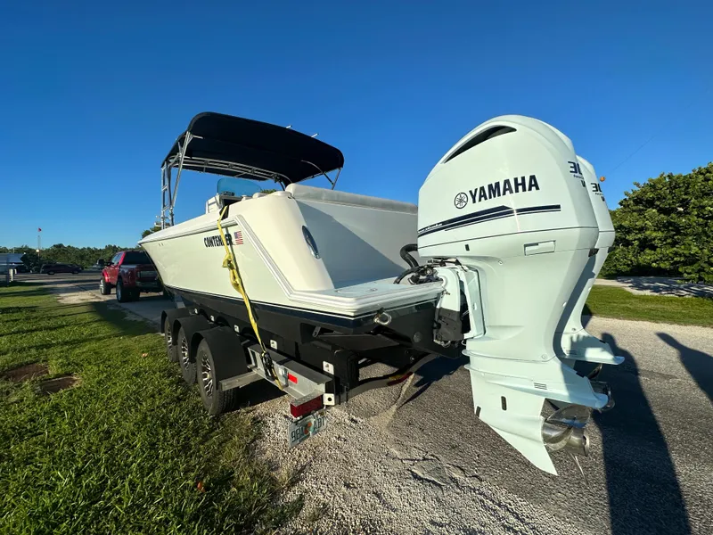Slide: The Image of 2012 Contender 32 LS boat with Yamaha outboard engine on trailer. - 6