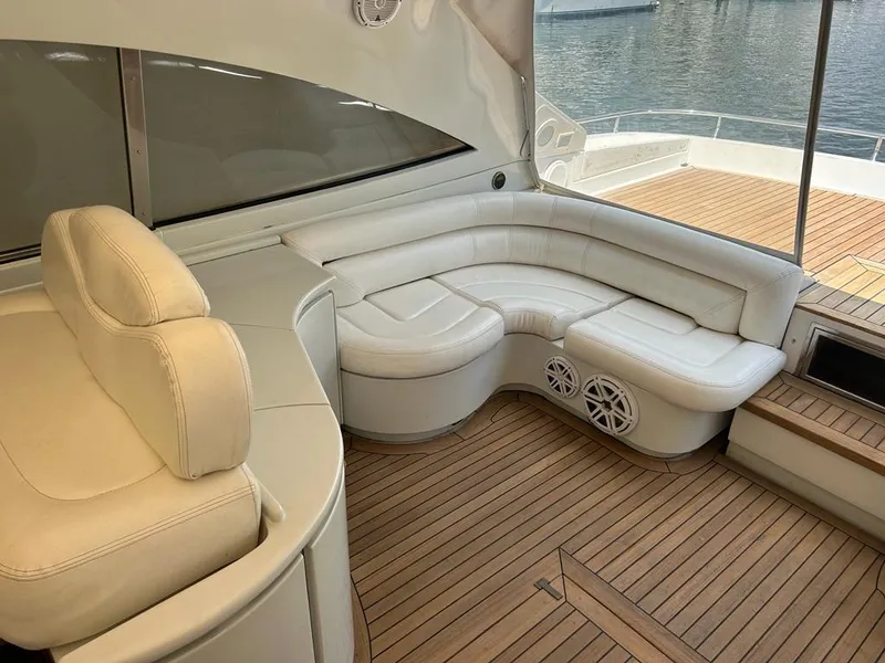 Slide: The Image of Luxurious seating area on a 1999 Pershing 54 yacht with teak flooring. - 10
