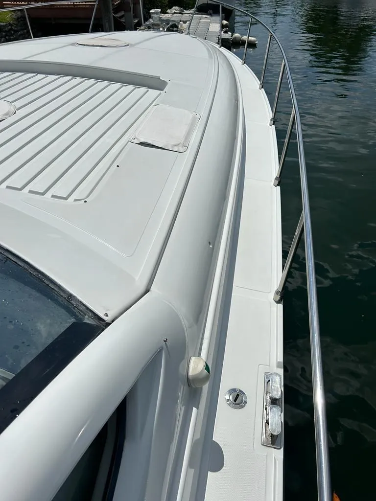 Slide: The Image of 1999 Pershing 54 yacht deck view with stainless steel railings. - 16