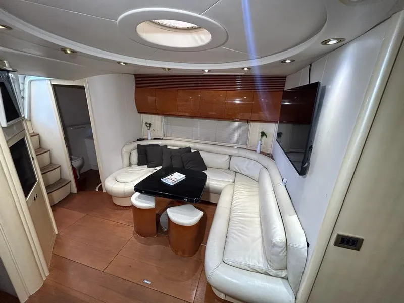 Slide: The Image of Luxurious interior of a 1999 Pershing 54 yacht with white leather seating and modern decor. - 21