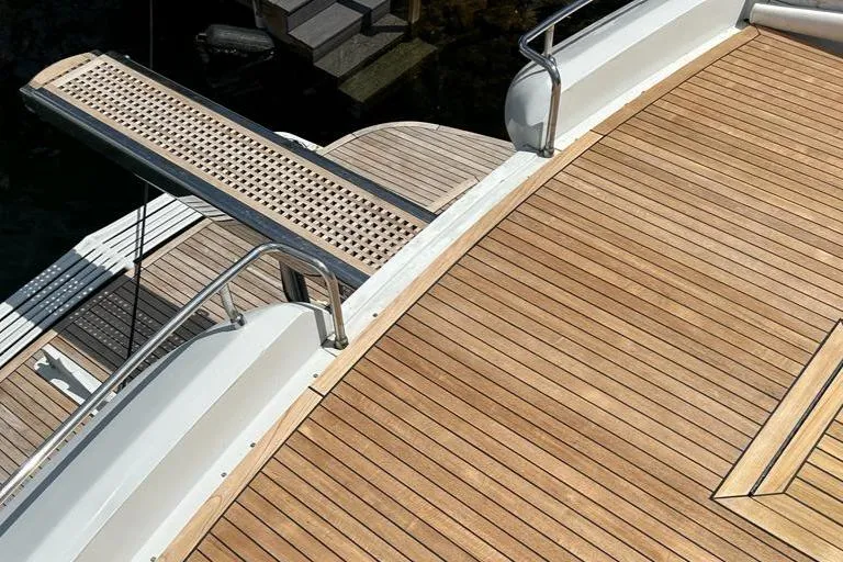 Slide: The Image of Teak deck of a 1999 Pershing 54 yacht with boarding plank. - 39