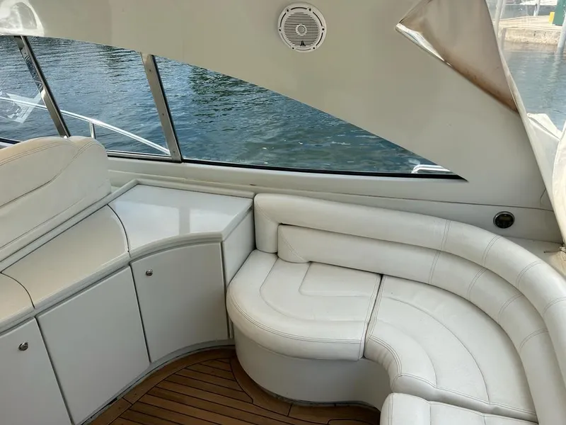 Slide: The Image of Interior seating area of a 1999 Pershing 54 yacht with white leather upholstery. - 8