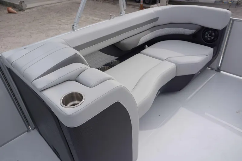 Slide: The Image of 2024 Hurricane FD 2360 RE3 boat interior with luxurious seating and cup holders. - 10