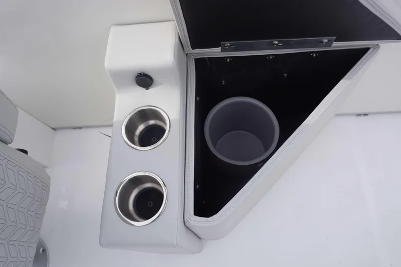 Slide: The Image of 2024 Hurricane FD 2360 RE3 boat cup holders and storage compartment. - 4