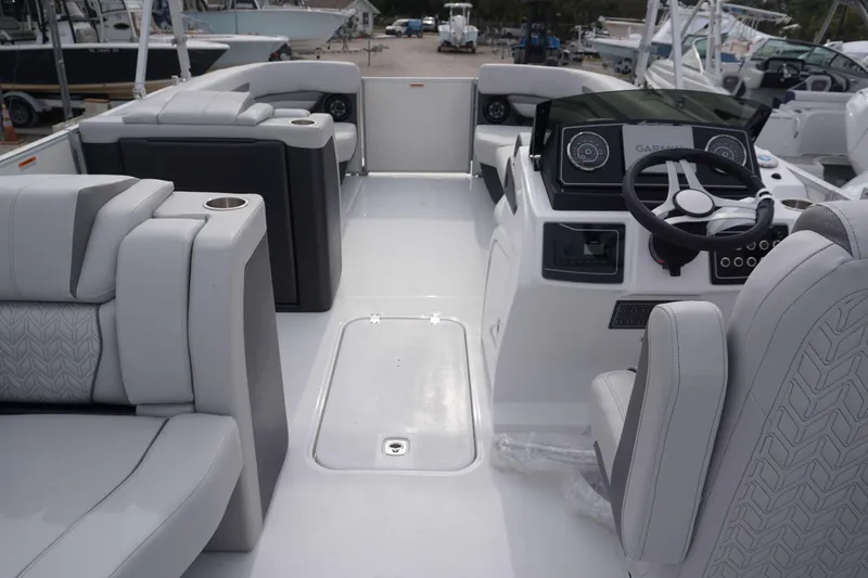 Slide: The Image of 2024 Hurricane FD 2360 RE3 boat interior with modern seating and steering console. - 7