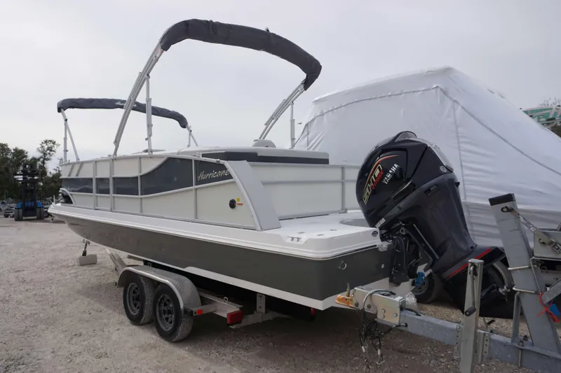 Slide: The Image of 2024 Hurricane FD 2360 RE3 boat on trailer with Yamaha outboard motor. - 8