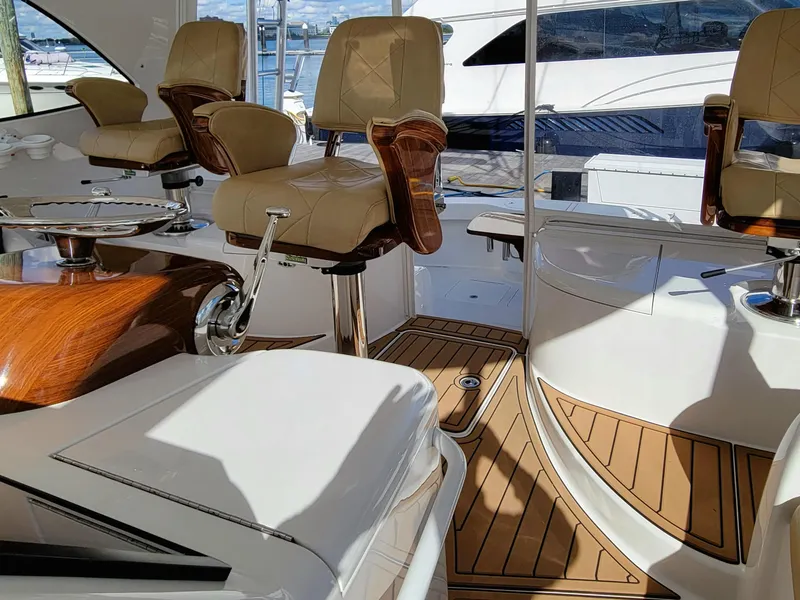 Slide: The Image of Luxurious 2016 Viking 42 Sport Tower yacht interior with elegant seating and wood accents. - 11