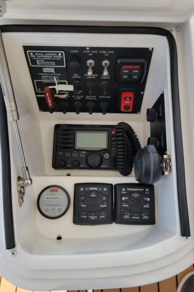 Slide: The Image of Control panel of a 2016 Viking 42 Sport Tower boat with communication equipment. - 14
