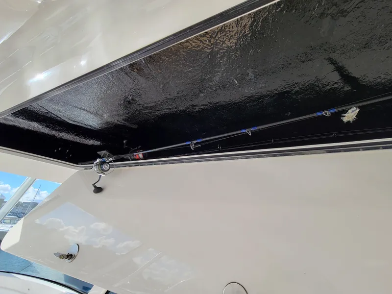 Slide: The Image of 2016 Viking 42 Sport Tower fishing rod storage compartment. - 17