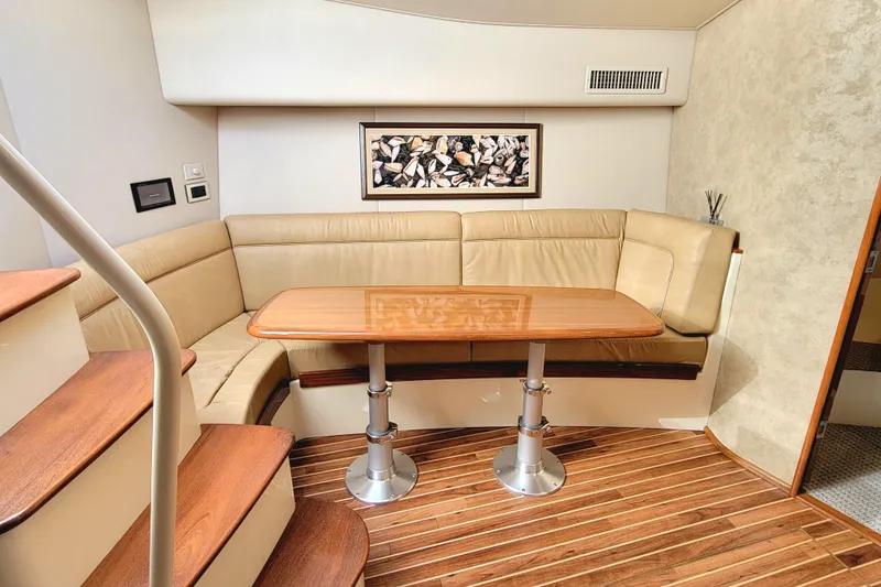 Slide: The Image of Luxurious interior of 2016 Viking 42 Sport Tower with elegant seating and wooden table. - 25