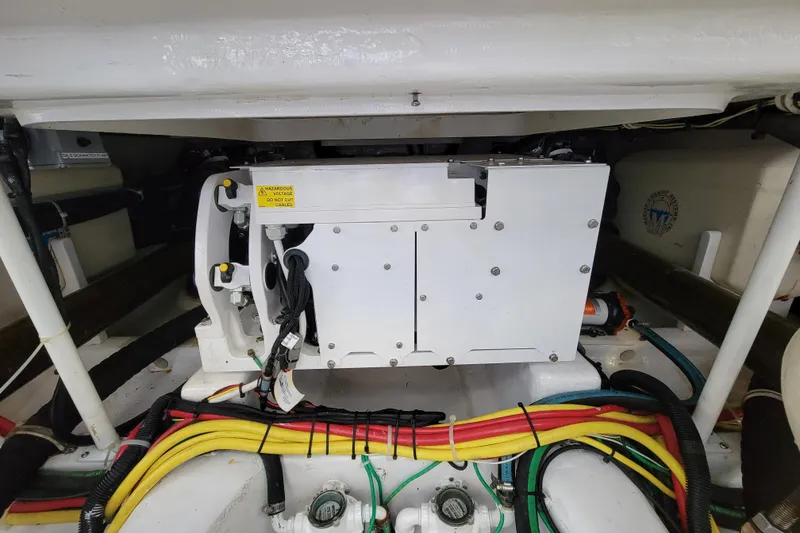 Slide: The Image of Engine compartment of 2016 Viking 42 Sport Tower with colorful wiring and components. - 33