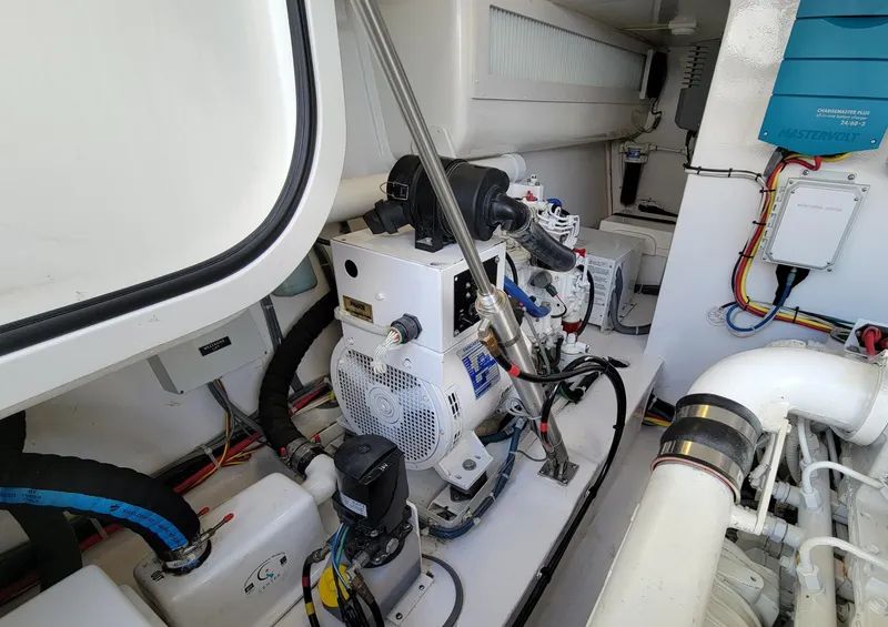 Slide: The Image of Engine room of 2016 Viking 42 Sport Tower with mechanical components and wiring. - 34