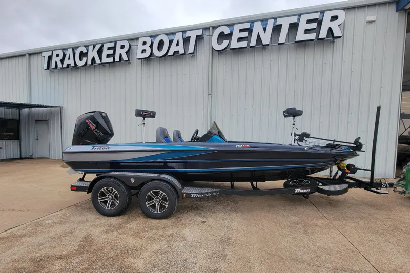 Slide: The Image of 2024 Triton 19 TrX boat on trailer at Tracker Boat Center. - 0