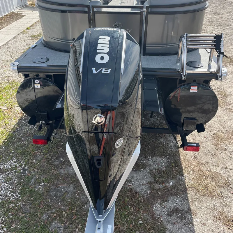 Slide: The Image of 2024 Regency 230 DL3 boat with a powerful 250 V8 engine, rear view. - 4