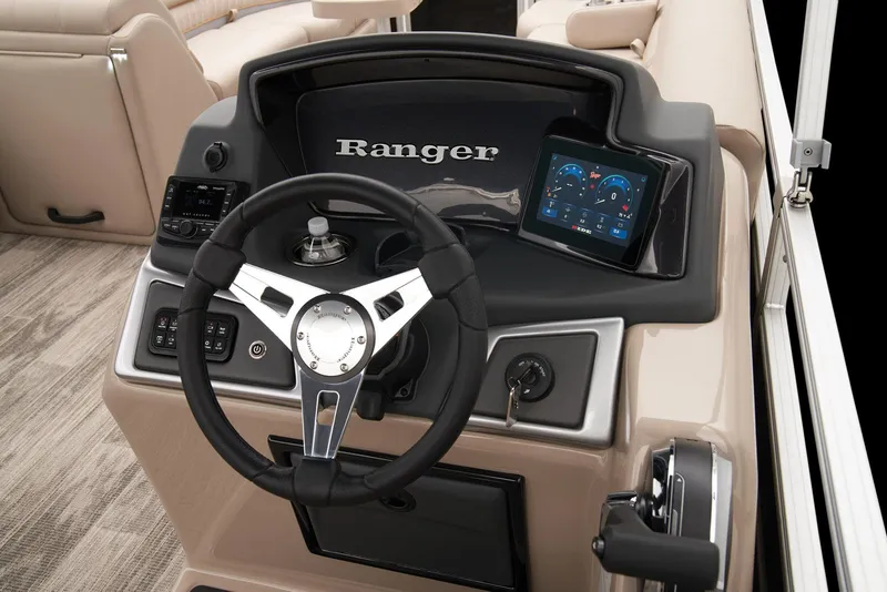 Slide: The Image of 2024 Ranger Reata 220C boat dashboard with steering wheel and digital display. - 27