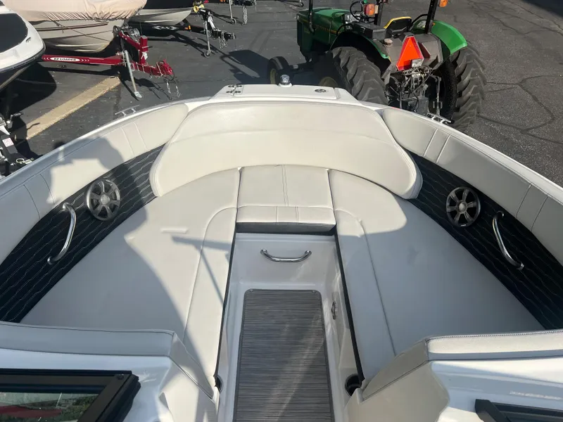 Slide: The Image of 2021 Sea Ray SPO 230 boat interior with seating and speakers. - 10
