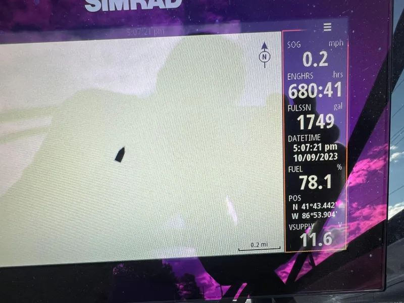 Slide: The Image of Simrad marine display on 2021 Sea Ray SPO 230 showing navigation data and fuel level. - 11