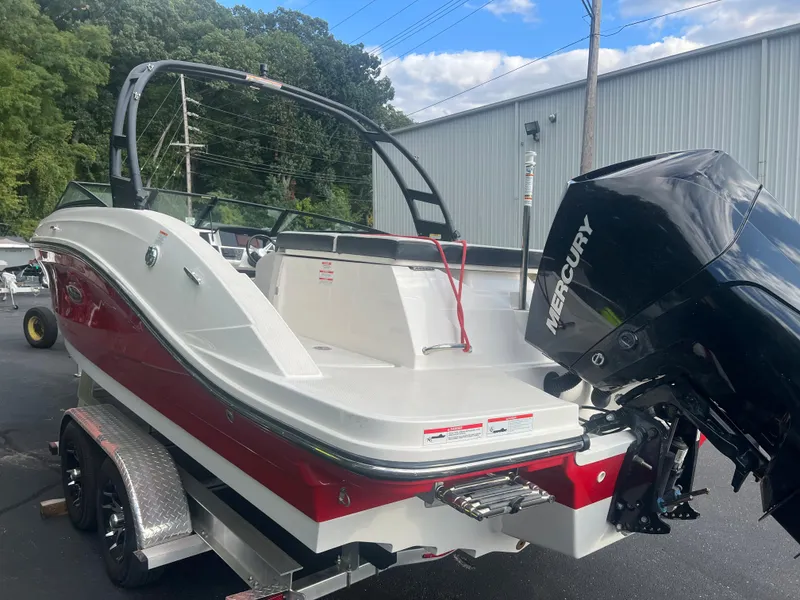 Slide: The Image of 2021 Sea Ray SPO 230 boat with Mercury engine on trailer. - 2