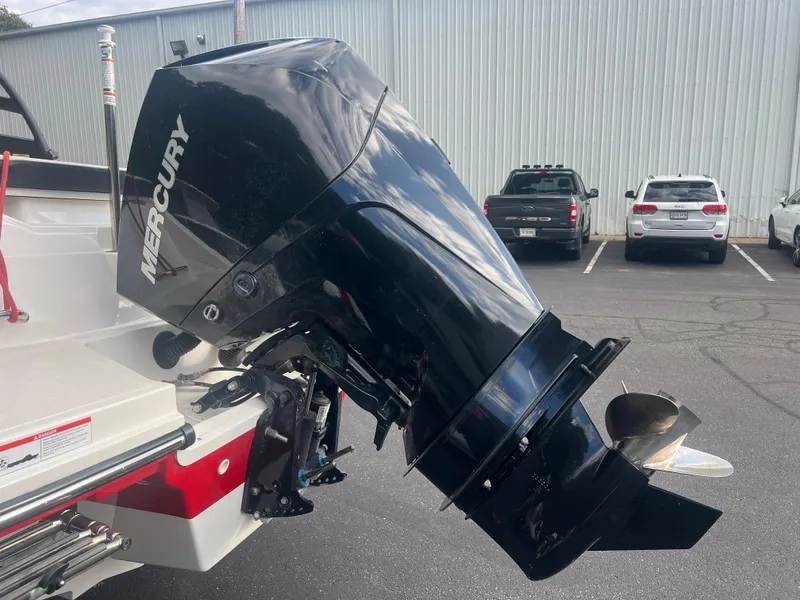 Slide: The Image of Mercury outboard motor on 2021 Sea Ray SPO 230 boat in parking lot. - 4