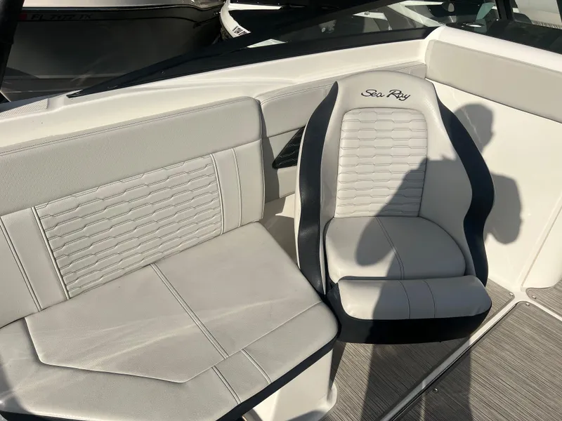 Slide: The Image of 2021 Sea Ray SPO 230 boat interior with white and gray seating. - 7