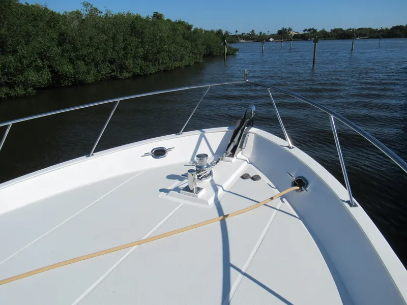 Slide: The Image of Bow of 2010 DeFever 48 Offshore yacht on calm water near mangroves. - 14