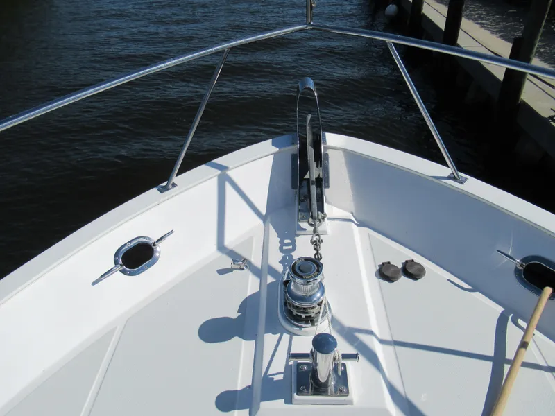 Slide: The Image of Bow of 2010 DeFever 48 Offshore yacht with anchor winch and railing. - 15