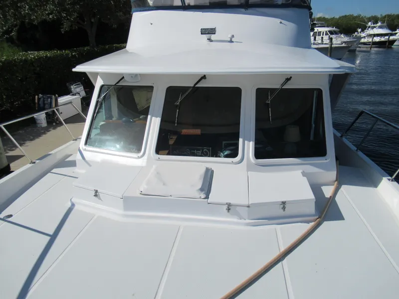 Slide: The Image of 2010 DeFever 48 Offshore yacht bow with windows and deck. - 16