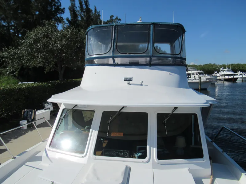 Slide: The Image of DeFever 48 Offshore 2010 yacht docked at a marina. - 17