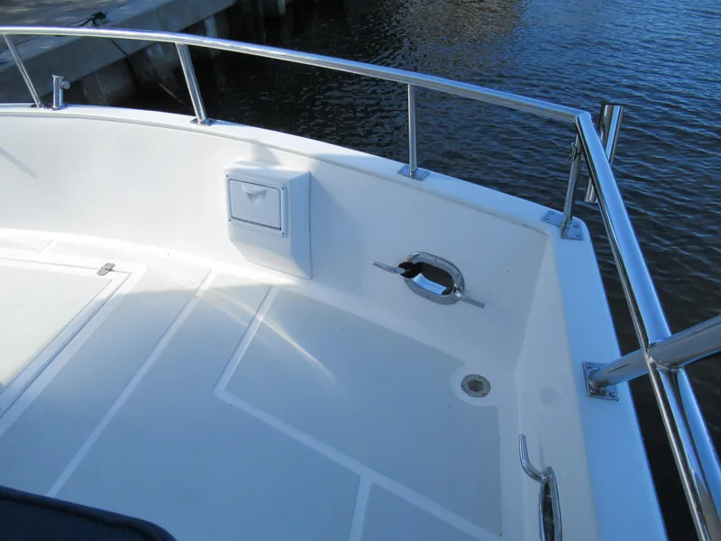 Slide: The Image of DeFever 48 Offshore 2010 boat deck with railing and water view. - 22