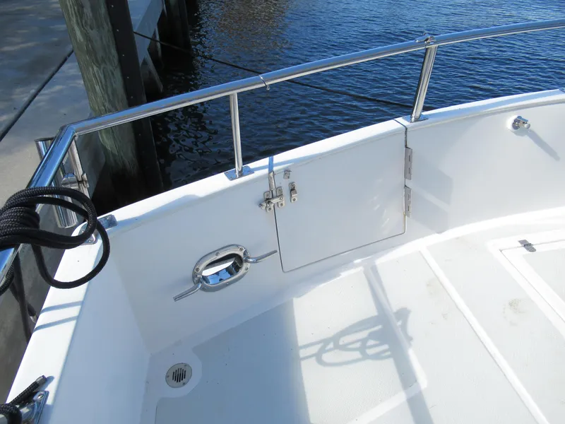 Slide: The Image of DeFever 48 Offshore 2010 boat deck with stainless steel railing and water view. - 25