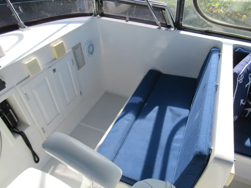Slide: The Image of Interior seating area of 2010 DeFever 48 Offshore yacht with blue cushions. - 31