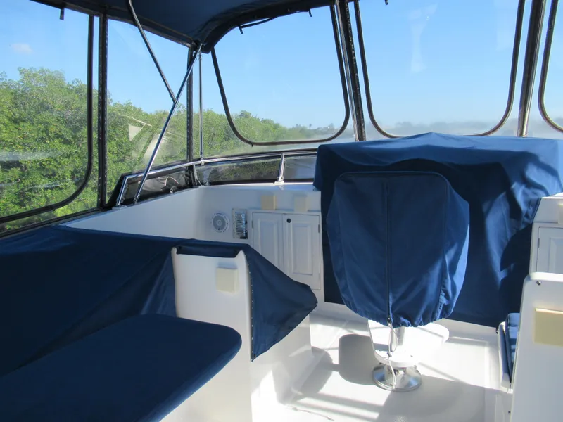 Slide: The Image of DeFever 48 Offshore 2010 yacht interior with blue covers and panoramic windows. - 35