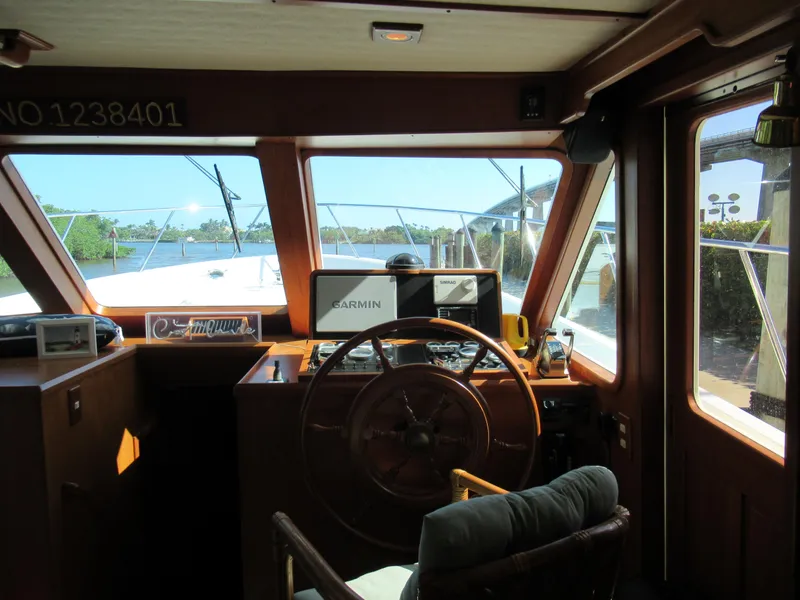 Slide: The Image of DeFever 48 Offshore 2010 helm station with Garmin navigation system and wooden steering wheel. - 36