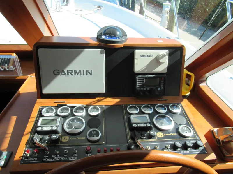 Slide: The Image of Helm station of 2010 DeFever 48 Offshore with Garmin and Simrad navigation systems. - 41