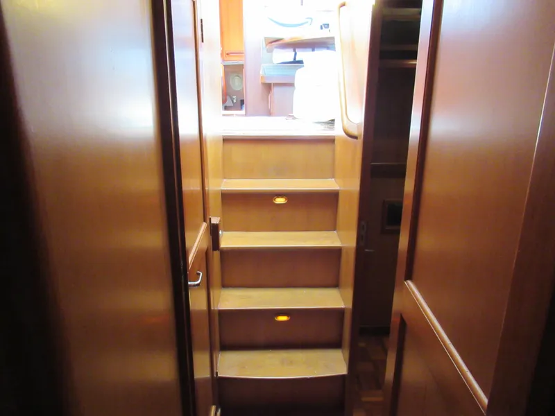 Slide: The Image of Interior stairs of 2010 DeFever 48 Offshore yacht with wooden finish. - 46