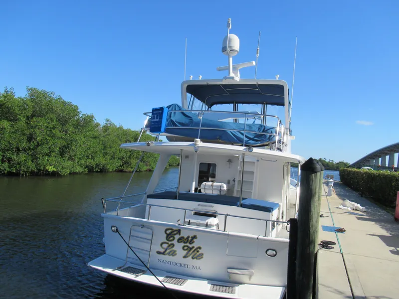 Slide: The Image of 2010 DeFever 48 Offshore yacht C'est La Vie docked by a river. - 8