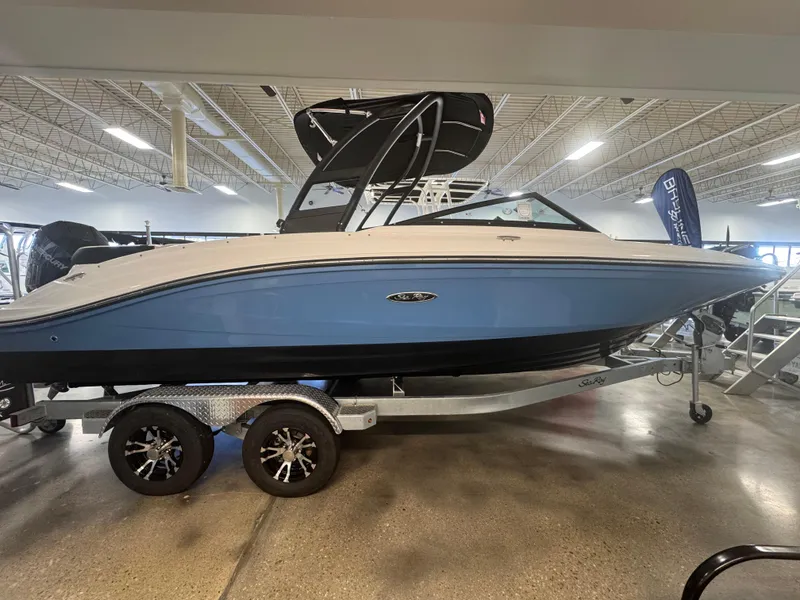 Slide: The Image of 2024 Sea Ray SPX 210 OB boat on display in showroom. - 0
