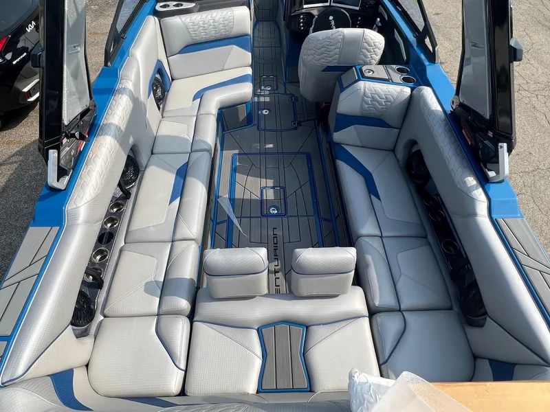 Slide: The Image of 2024 Centurion Ri245 boat interior with spacious seating and modern design. - 5