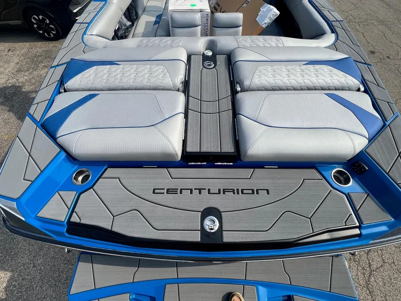 Slide: The Image of 2024 Centurion Ri245 boat with luxurious seating and sleek design. - 9