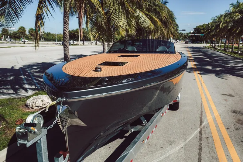 Slide: The Image of 2020 Frauscher 1017 GT boat on trailer, palm trees in background. - 19