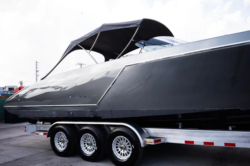 Slide: The Image of 2020 Frauscher 1017 GT luxury boat on a triple-axle trailer. - 22