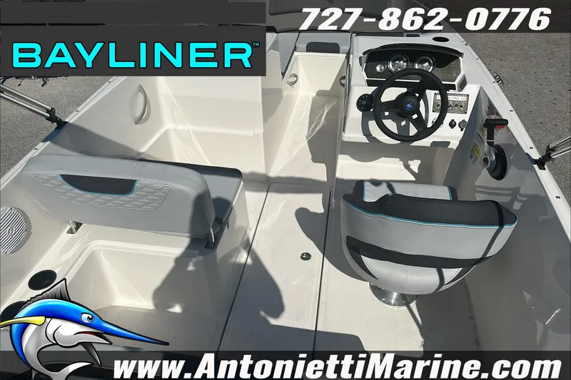 Slide: The Image of 2024 Bayliner Element M19 boat interior with steering wheel and seating, displayed by Antonietti Marine. - 12
