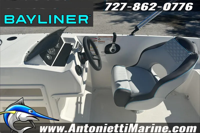 Slide: The Image of 2024 Bayliner Element M19 boat interior with steering wheel and seat, Antonietti Marine branding. - 16