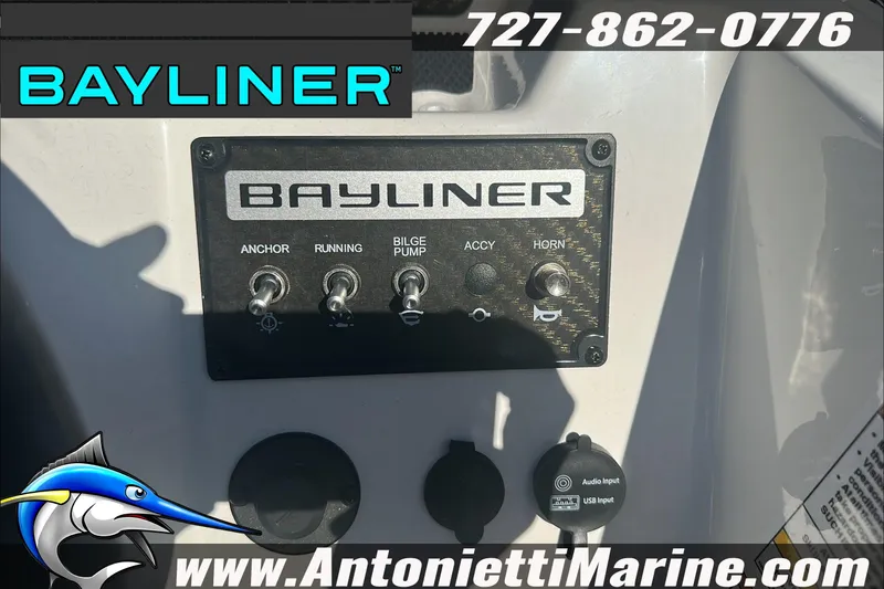 Slide: The Image of 2024 Bayliner Element M19 control panel with switches and audio input. - 20