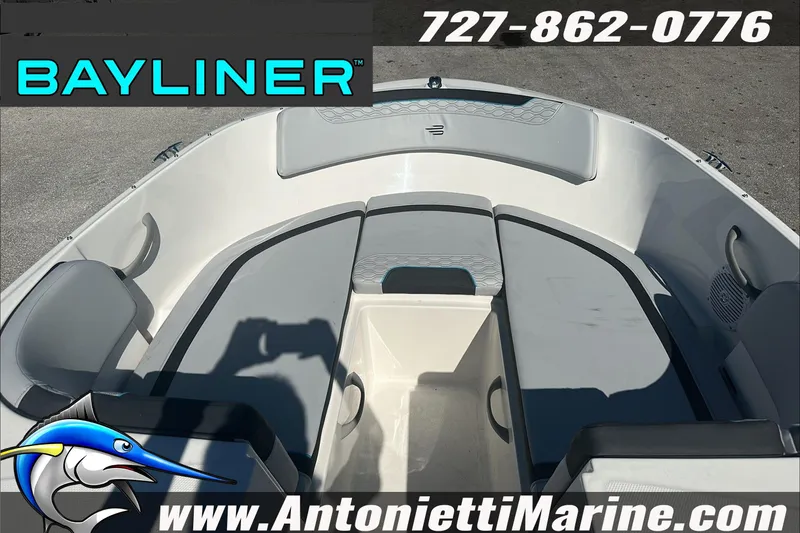 Slide: The Image of 2024 Bayliner Element M19 boat interior with seating, contact info, and logo. - 23