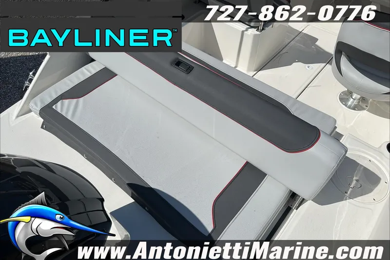 Slide: The Image of 2024 Bayliner Element M19 boat interior with seating, logo, and contact information. - 11